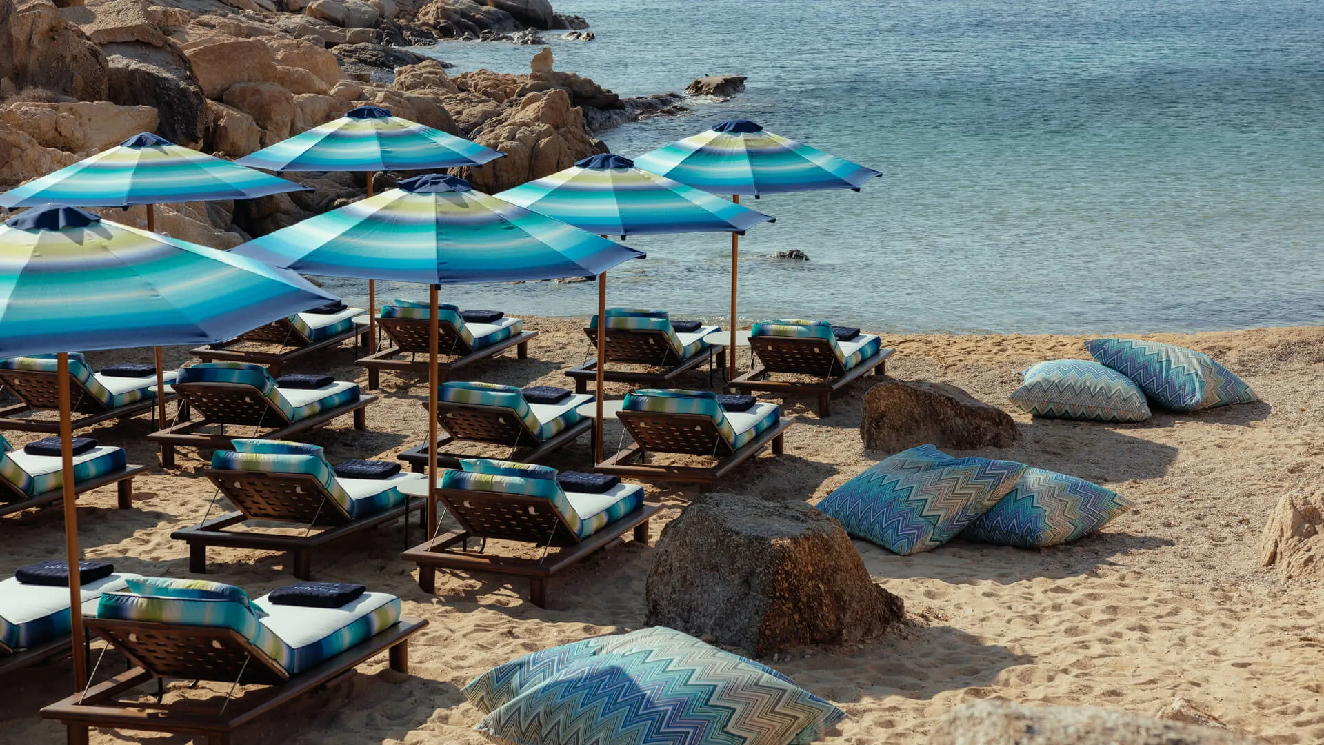 Missoni Beach Resort: Exclusive beach area at Cali Mykonos, adorned with Missoni beach towels and umbrellas
